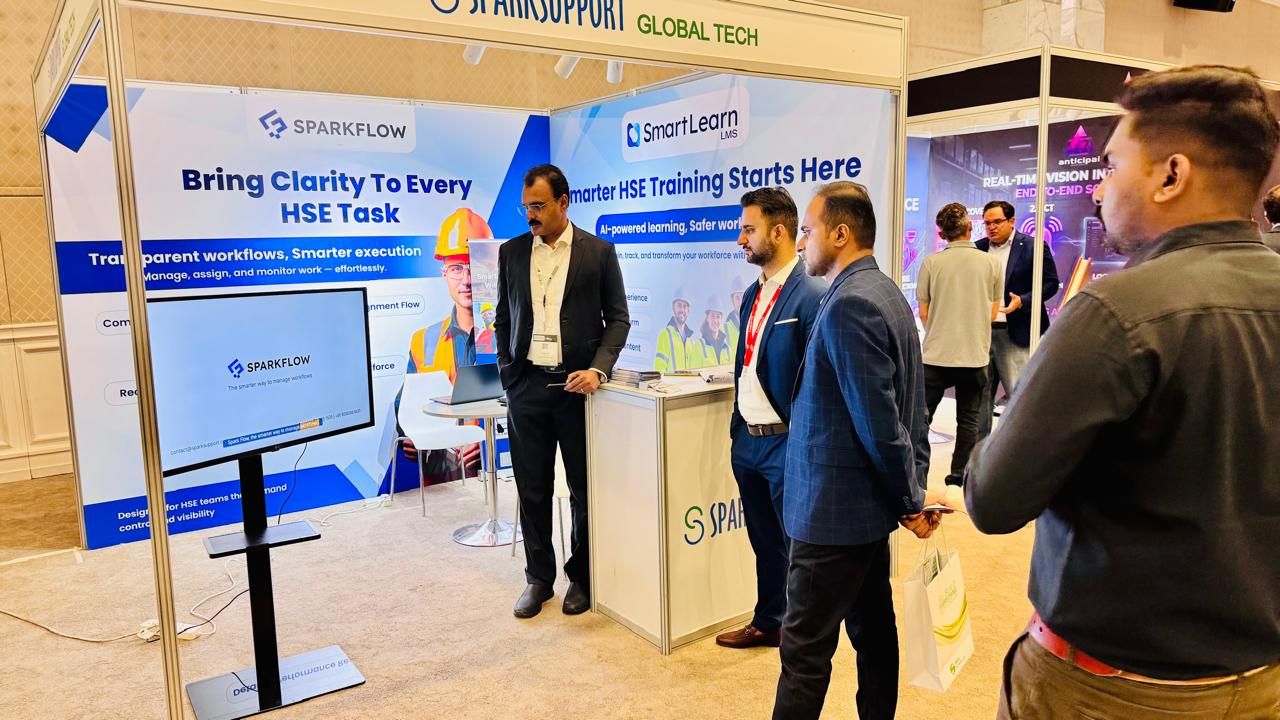 Visitors engaging at the SparkSupport booth featuring SparkFlow and SmartLearn LMS, HSE Expo Sharjah