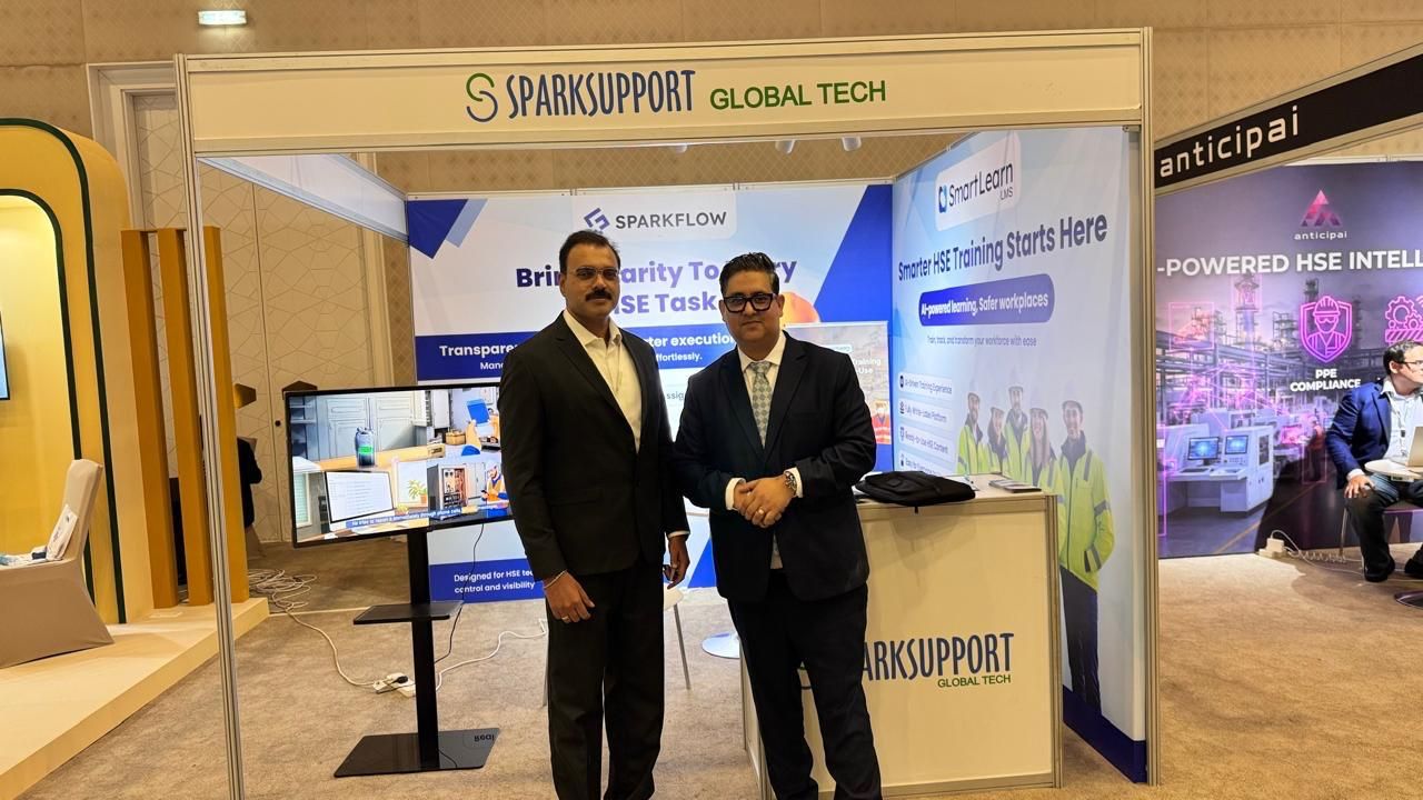 SparkSupport representatives welcoming visitors at the HSE exhibition booth
