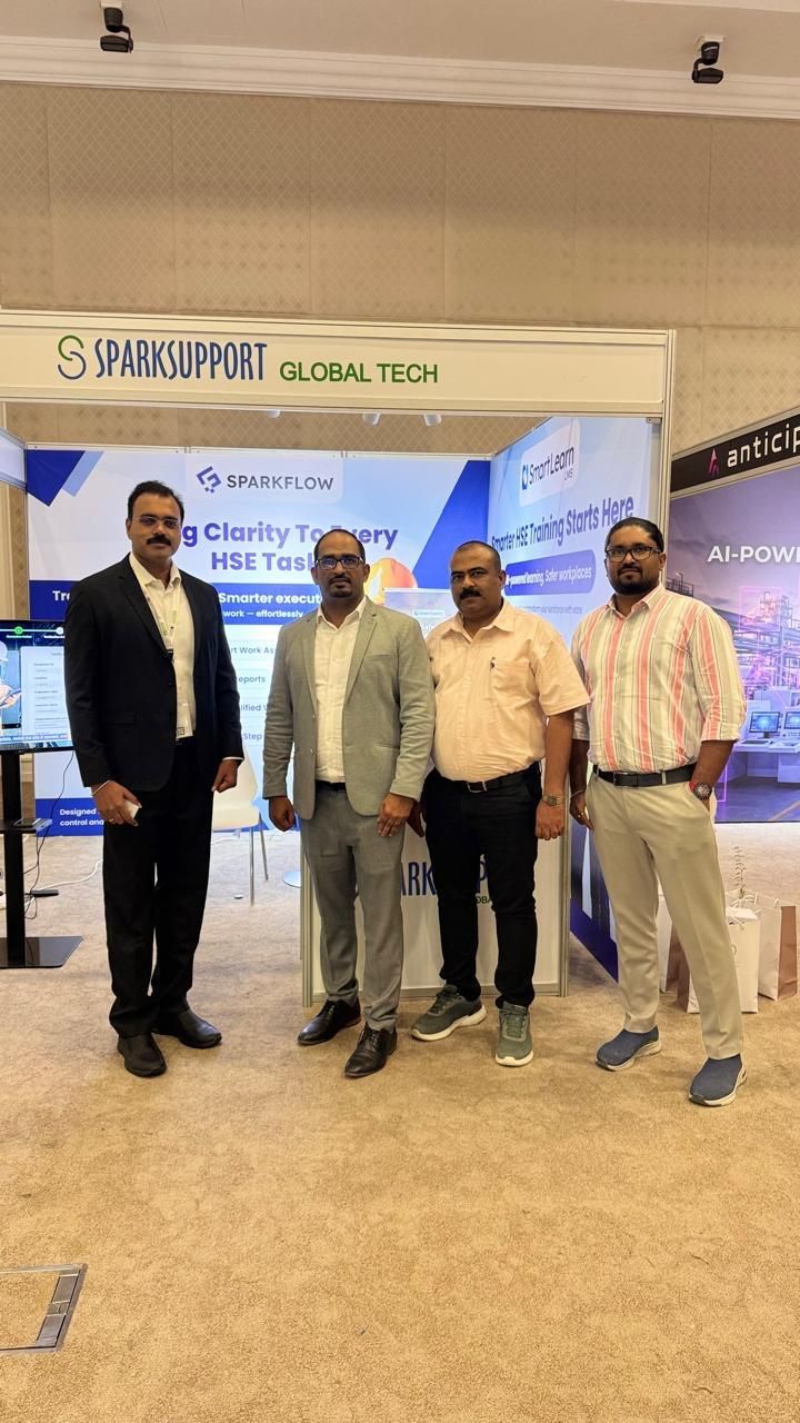 SparkSupport visionaries posing together at the SmartLearn LMS booth